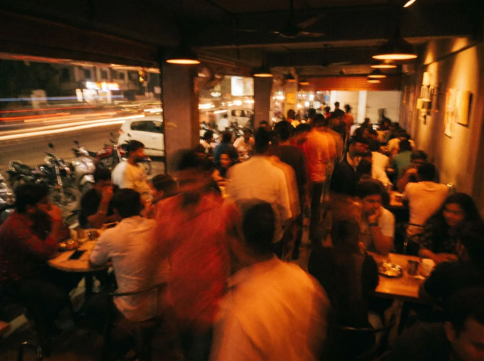 Motion-blurred crowd in a bar